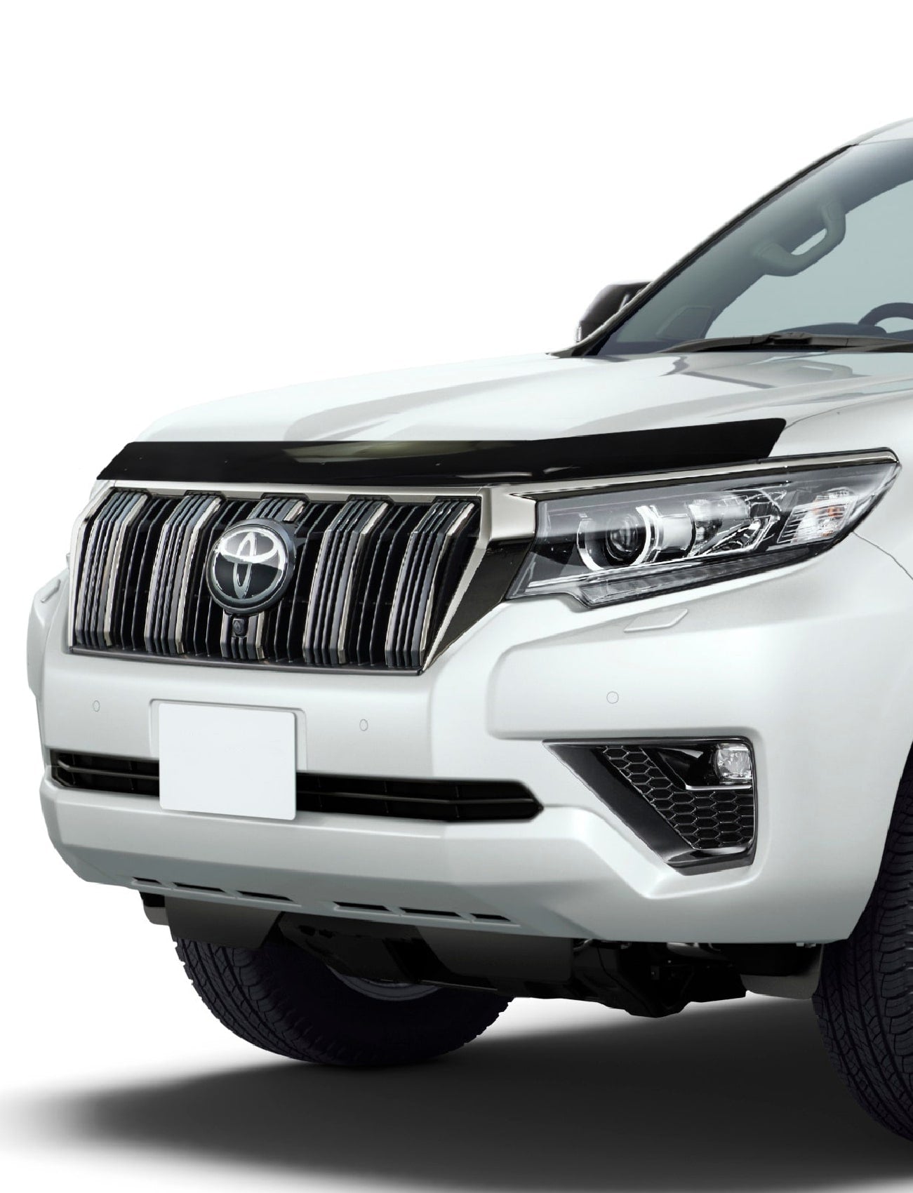 Front view of a white SUV with a prominent logo and sleek headlights. Equipped with a Sunland Protective Plastics Bonnet Protector in Dark Tint for the VW Amarok NF 12/2022-On (VW115BT), it ensures protection against stone chips in its modern design.