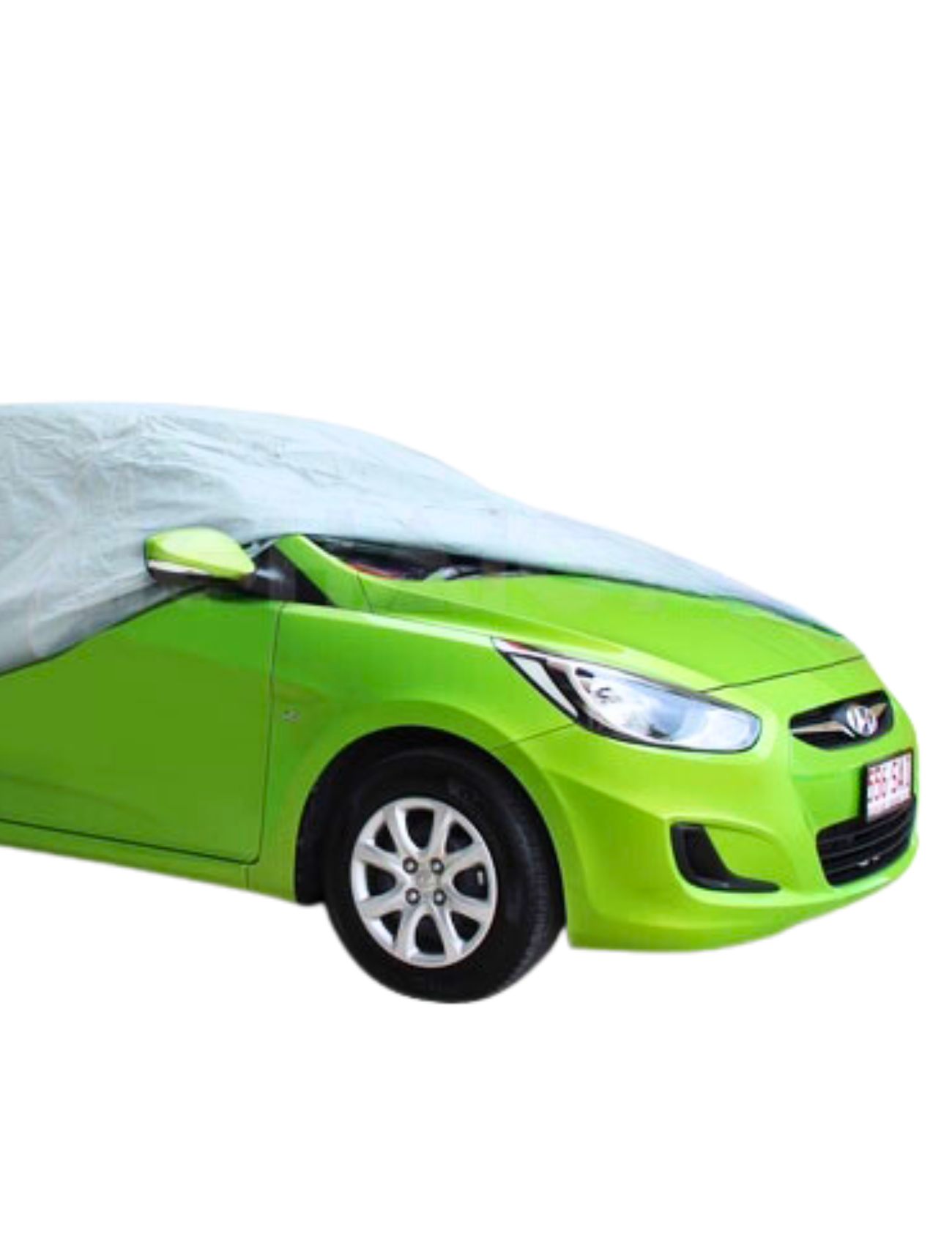A bright green car is mostly covered by a Sunland-Protection WeatherTec Ultra Cover - HATCHBACK SMALL for UV defense. The breathable fabric sits on the roof and rear, leaving the front and right exposed against a plain white background.
