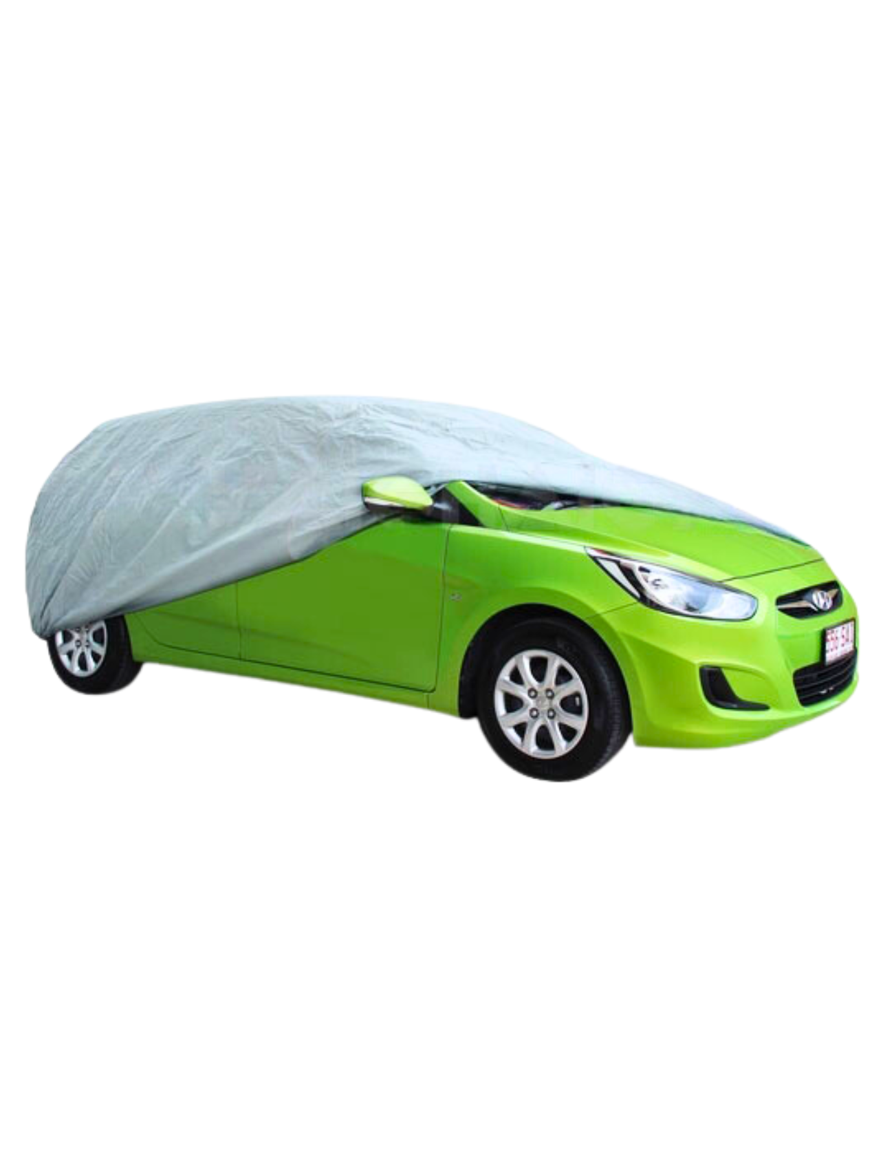 A vivid green sedan is partially covered with the Sunland-Protection's WeatherTec Ultra Cover, HATCHBACK SMALL. Its breathable fabric and UV protection are on display, leaving the vehicle's front and wheels visible, emphasizing the car's vibrant color against the neutral cover.