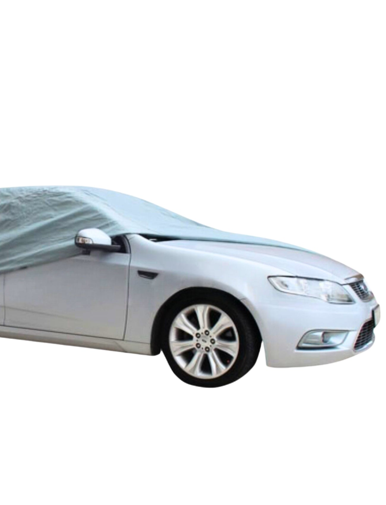 A silver car peeks from beneath the Sunland-Protection WeatherTec Ultra Cover XLARGE, designed for extra-large sedans. Its UV-protective layer reveals only the front wheels and headlights, ensuring safety against elements against a plain white backdrop.