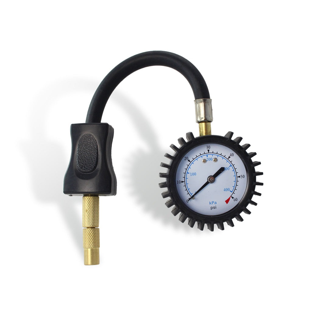 The Dr Air Tyre Pressure Gauge 60psi, featuring a black and gold design, comes equipped with a rubber grip and flexible hose, making it ideal for 4WDs. It has a round dial that displays pressure measurements in both psi and kPa, with a needle indicating the current reading—essential for monitoring tire deflation.