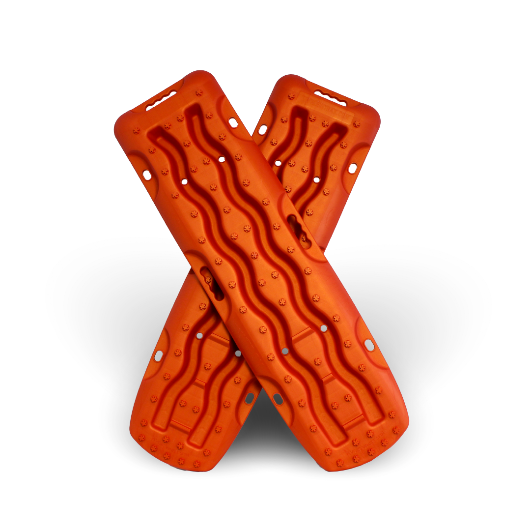 Two Exitrax Recovery Boards 1110 Series in Metallic Sunrise Red stand upright, crossed in an "X" on a white background, providing reliable traction angle for vehicle recovery.