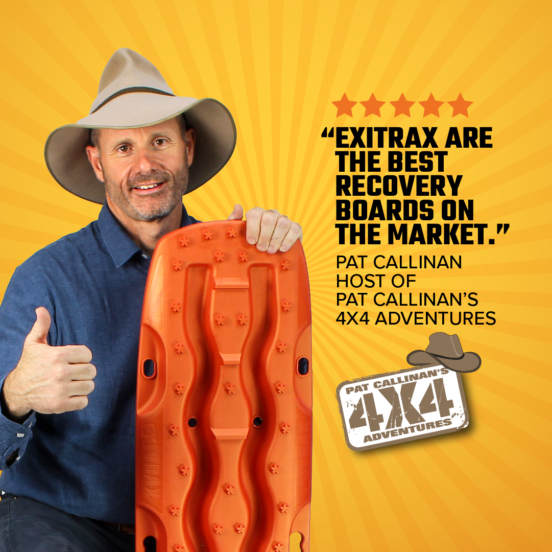 A man in a wide-brimmed hat and blue shirt holds a Recovery Boards 1110 Series - Metallic Sunrise Red by Exitrax, giving a thumbs up. Text: “Exitrax’s Traction Angle design and Lifetime Warranty make them the best recovery boards.” Pat Callinan’s 4x4 Adventures logo.