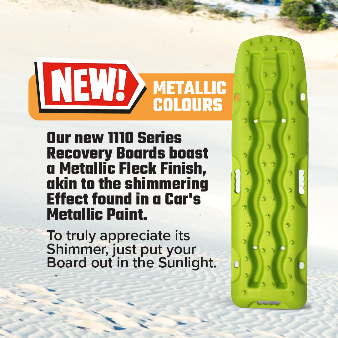 A vibrant Metallic Sunrise Red Exitrax Recovery Board 1110 Series stands on sand, showcasing its wavy surface. Promoted features include metallic fleck finish, improved Traction Angle, new metallic colours, and a Lifetime Warranty in bold text.
