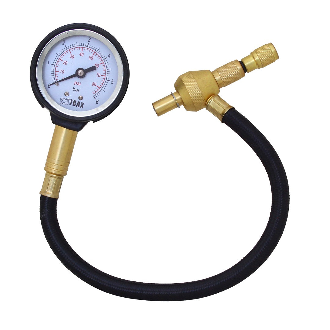 A "ProTrak" tire pressure gauge, equipped with a black rubber hose and brass connectors, displays PSI and bar measurements on its dial. It's perfect for off-road traction needs with its clear indicator needle. Consider pairing it with the Exitrax Tyre Deflator for scenarios requiring reduced tire pressure.
