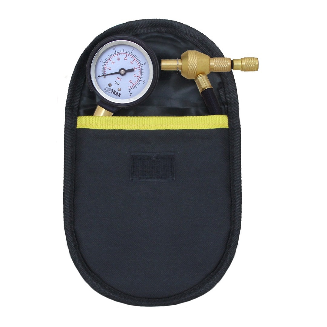 A black and yellow protective case from Exitrax houses the Tyre Deflator, featuring a pressure gauge with partially visible red-numbered dial. Connected to brass fittings and a black hose, this setup is perfect for off-road traction. The case secures with a convenient hook-and-loop closure.