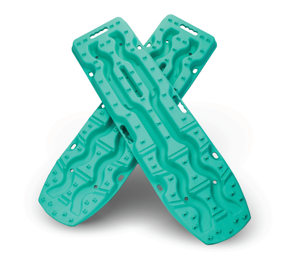 Two aqua marine Exitrax Recovery Boards Ultimate 1150 with textured surfaces are crossed on a white background, designed to provide optimal traction angles for vehicle recovery on sand, mud, or snow.