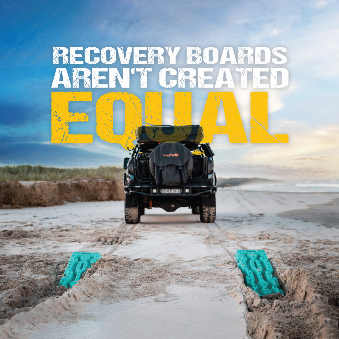 A black SUV is parked on a sandy beach next to the "Recovery Board 1110 Series - Black + Recovery Board Mounts Bundle" by Exitrax. Cloudy skies hint at sunset above, with bold white and yellow text reading, "Recovery boards aren't created equal," stressing the importance of 4x4 Recovery gear.