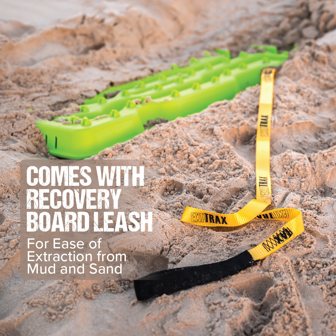A black Exitrax Recovery Board Ultimate 1150 is partially buried in sand, featuring yellow and black leashes. Text reads, "Comes with recovery board leash for ease of extraction from mud and sand." Enjoy the added traction with our boards, backed by a lifetime warranty for peace of mind.