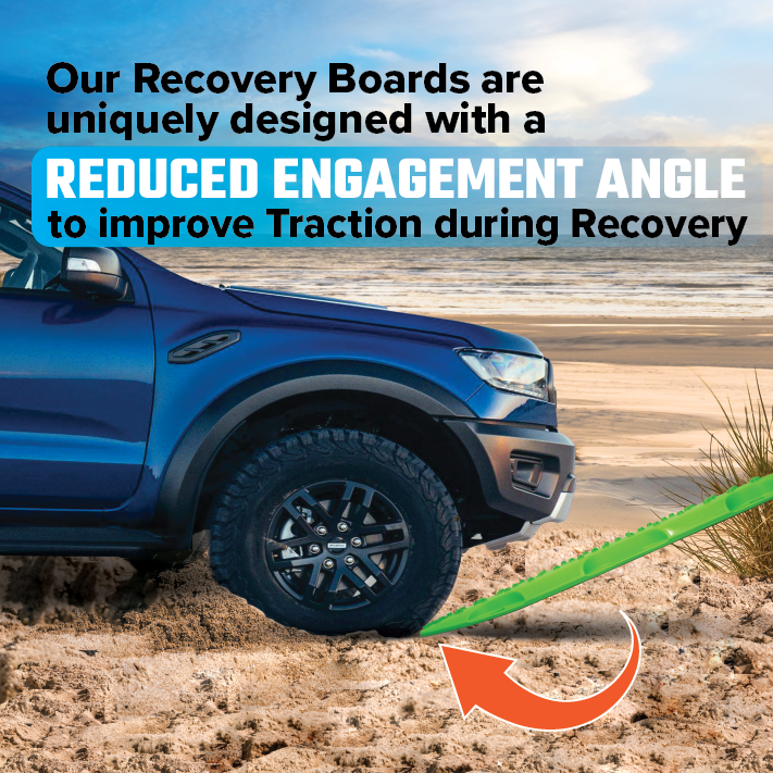 A blue off-road vehicle on a sandy beach uses Exitrax Recovery Boards Ultimate 1150 - Blood Orange with Recovery Board Mounts beneath its front tire, featuring a reduced engagement angle for improved traction during recovery.