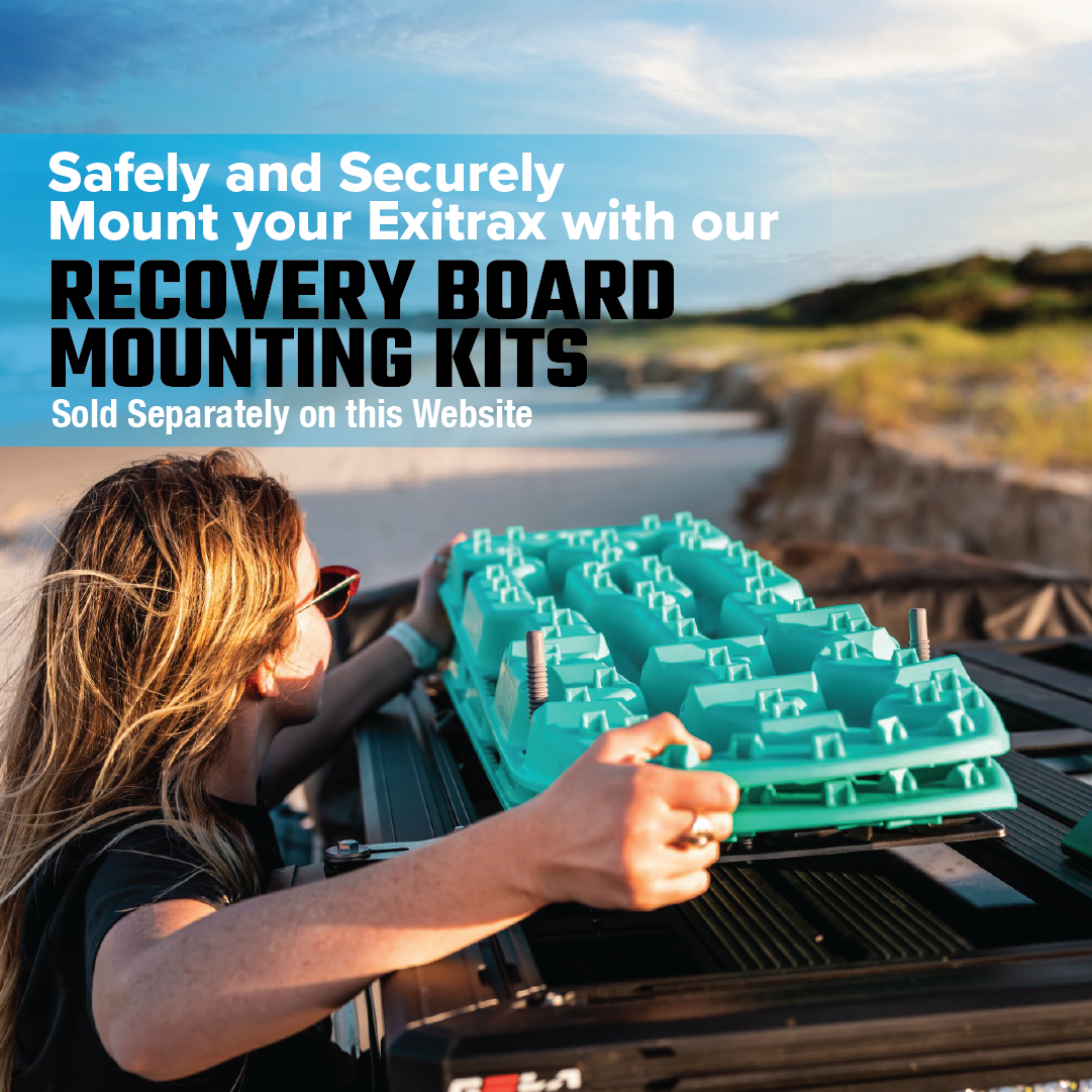 A woman secures Exitrax Recovery Boards Ultimate 1150 - Gunmetal Grey to a roof rack on a scenic road. Text highlights mounting kits with Lifetime Warranty, ensuring safe, secure installation for every adventure.