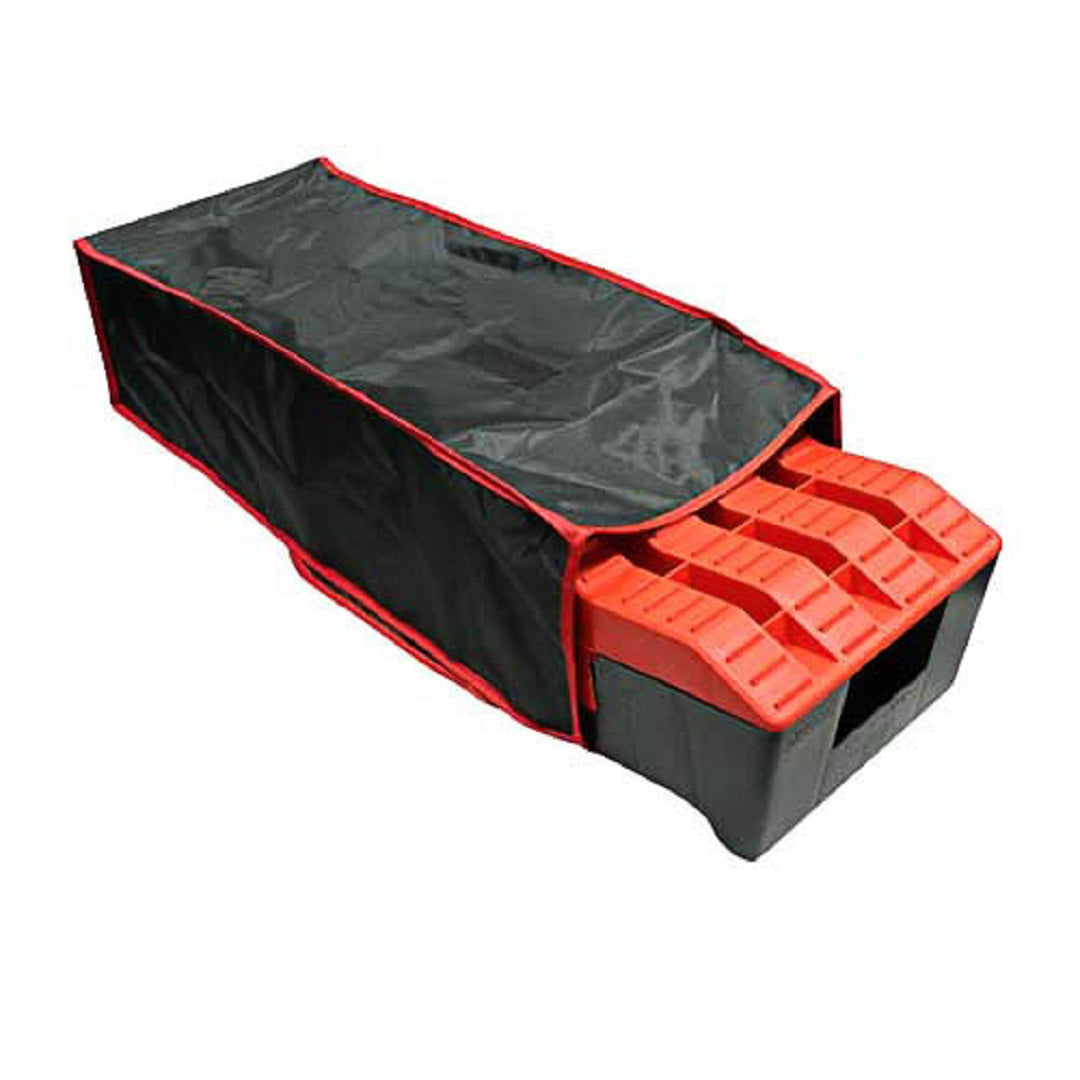 A black and red storage bag labeled as the Caravan Levelling Ramp Storage Bag by Explore partially covers a set of stackable red blocks, similar to CVL2 levelling ramps, arranged in a rectangular shape. The bag's open flap reveals the blocks inside.