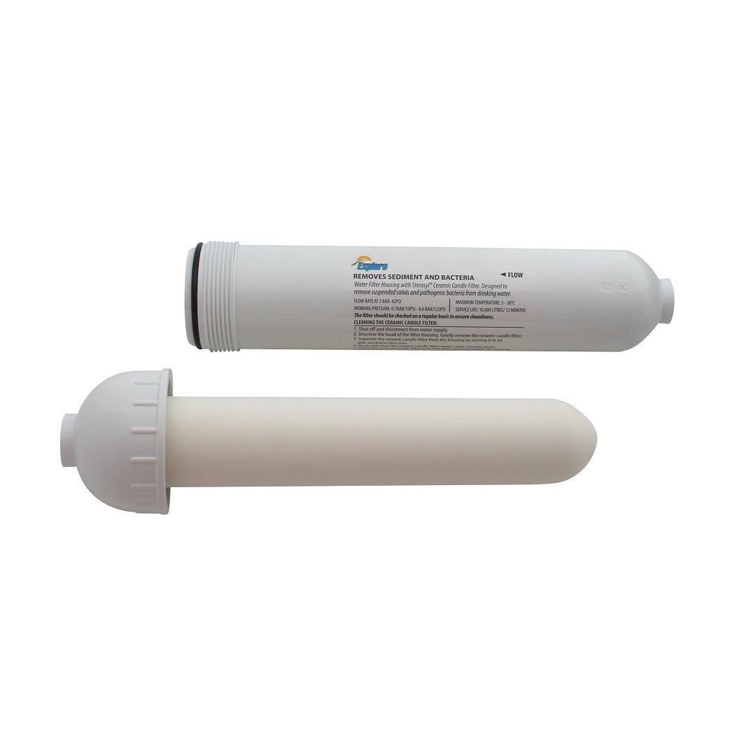 Image of two Explore Inline Water Filter Housing cartridges lying side by side on a white background. One cartridge is fully visible, while the other one has its end cap removed to show its internal cylindrical filter element. Both cartridges are white with text and a label, designed for purifying drinking water.