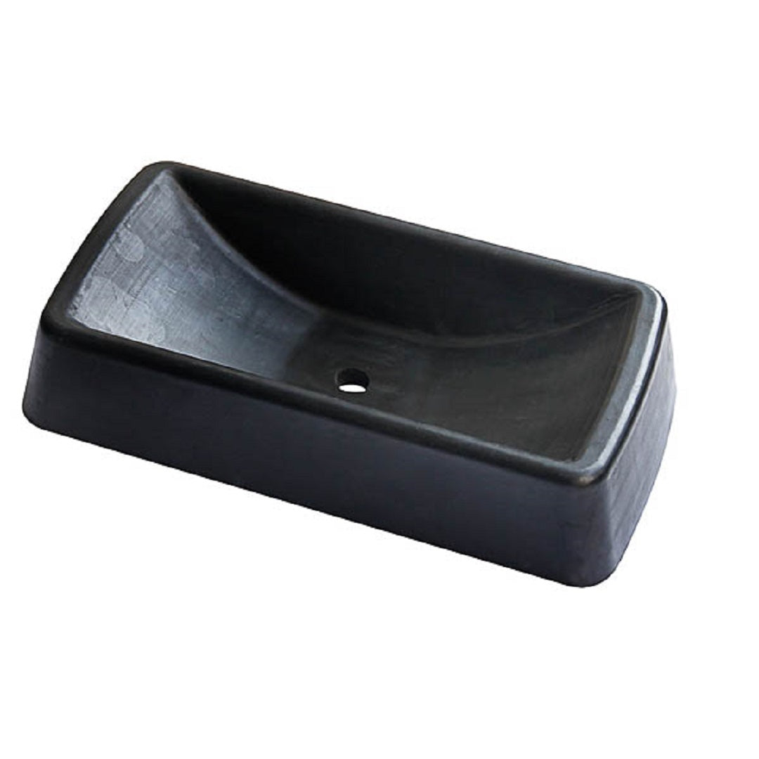 The Cargo Mate Jockey Wheel Receiver Large is a black, rectangular parking stop made from durable moulded rubber with a slightly curved top and central hole for ground securing, ideal for preventing trailer movement.