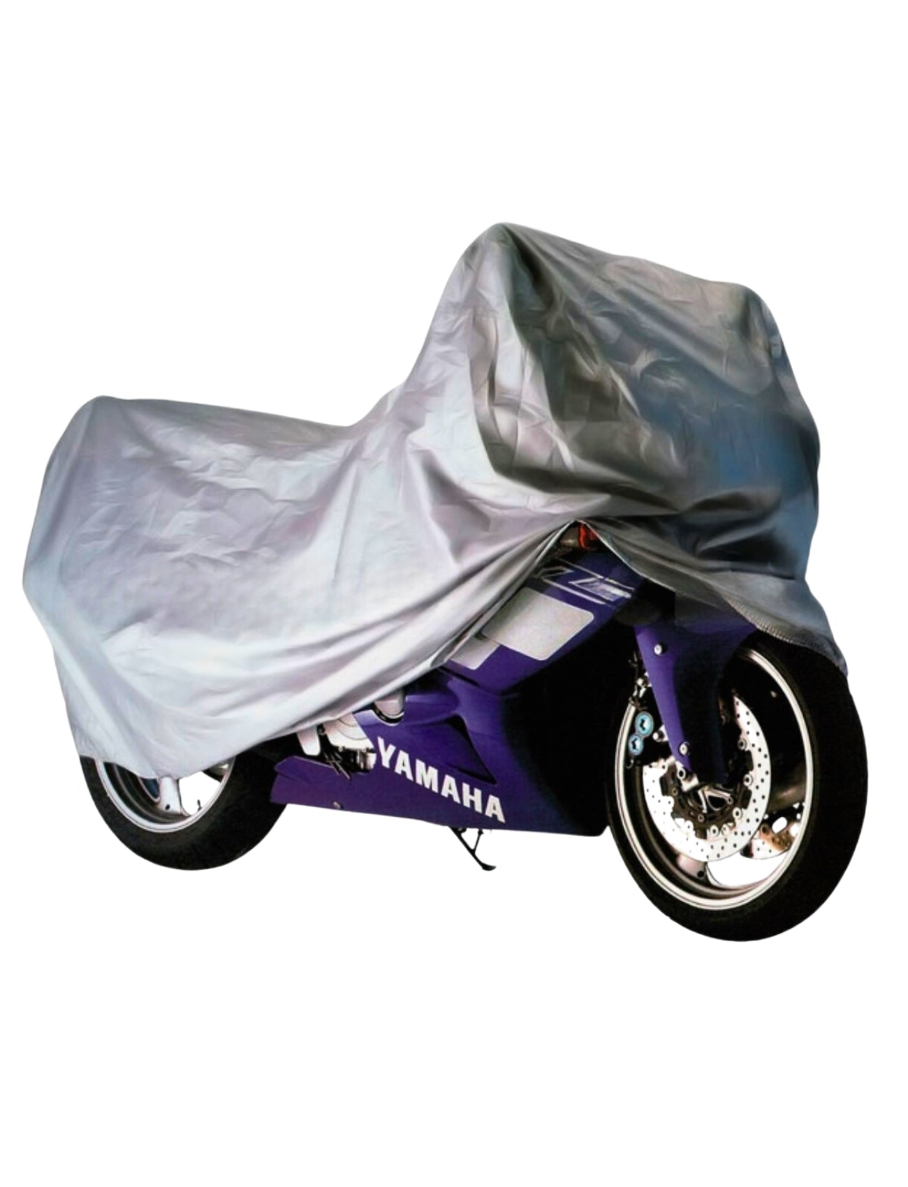 A blue Yamaha motorcycle peeks out from beneath a Sunland-Protection Motorcycle Cover to 500cc, its front wheel and emblem visible. The silver tarp, offering waterproof and UV protection, drapes over the rest of the bike.