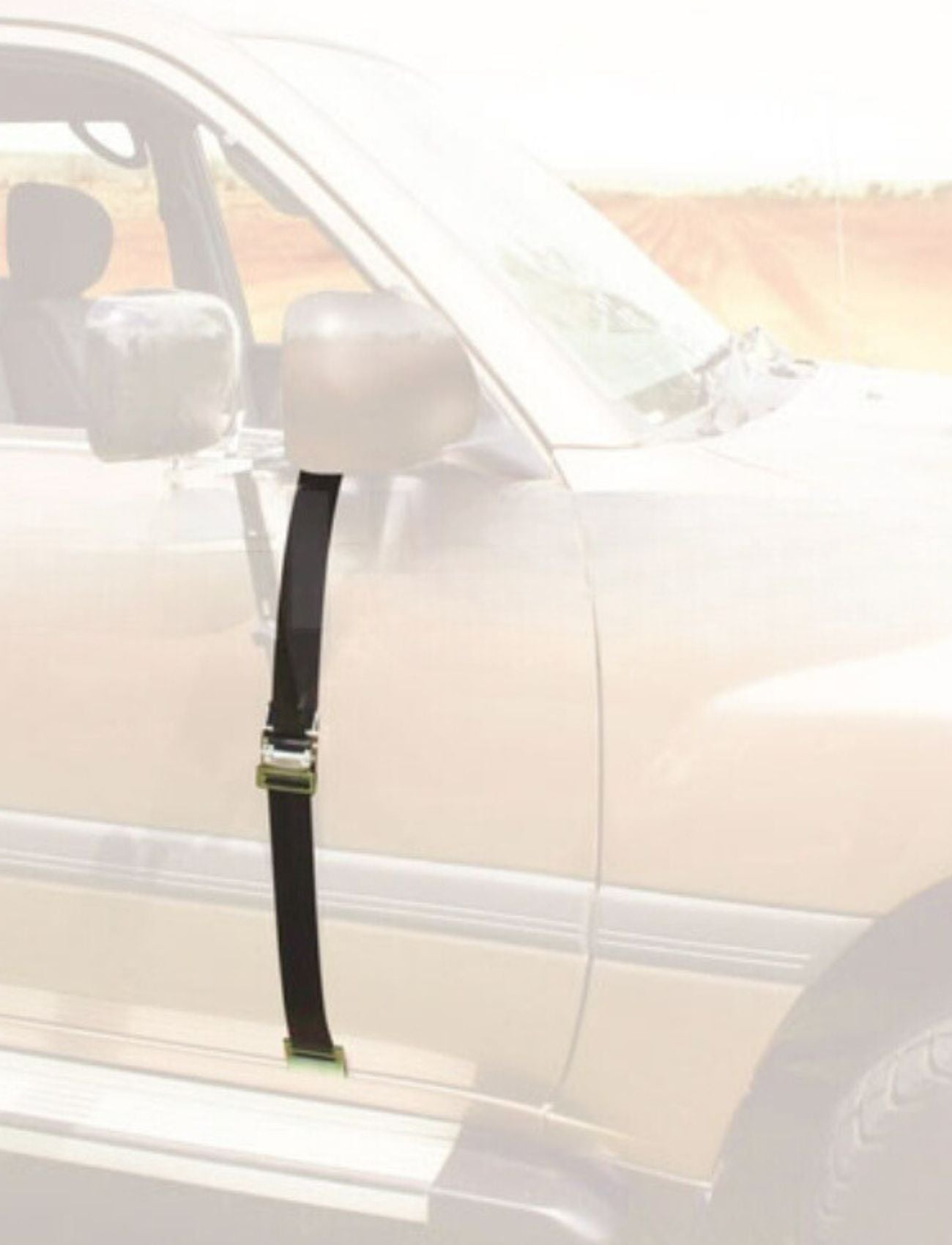 A MIRROR WIDE DOOR BASE STRAP - SUITS MH3015 by Sunland-Protection is attached to a white car's side mirror and door handle, securing the door. A blurred outdoor scene is in the background.