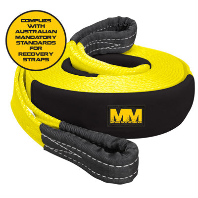 The Mean Mother Snatch Strap 8,000kg Safety Bundle features a coiled yellow and black nylon webbing with reinforced ends. A circular label confirms its compliance with Australian mandatory standards for snatch straps. The "MM" logo of the Mean Mother 4x4 brand is prominently displayed on the black section of the strap, crafted specifically for efficient kinetic energy harnessing.