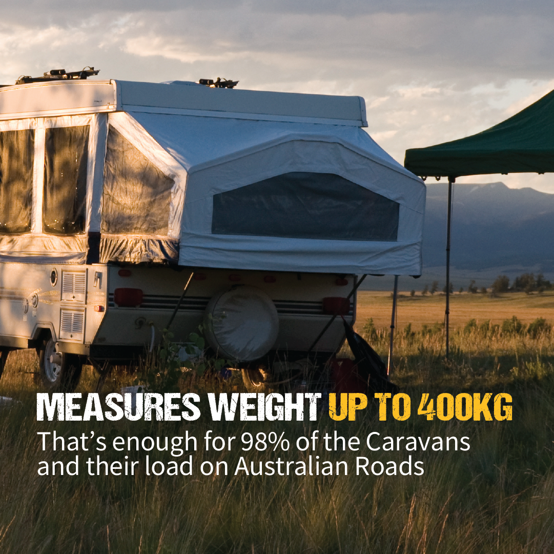 A white caravan and a green tent rest on a grassy field under cloudy skies with distant mountains. The text reads: "Explore Tow Ball Weight Scales measure weight up to 400kg, ideal for 98% of caravans' load distribution on Australian roads.