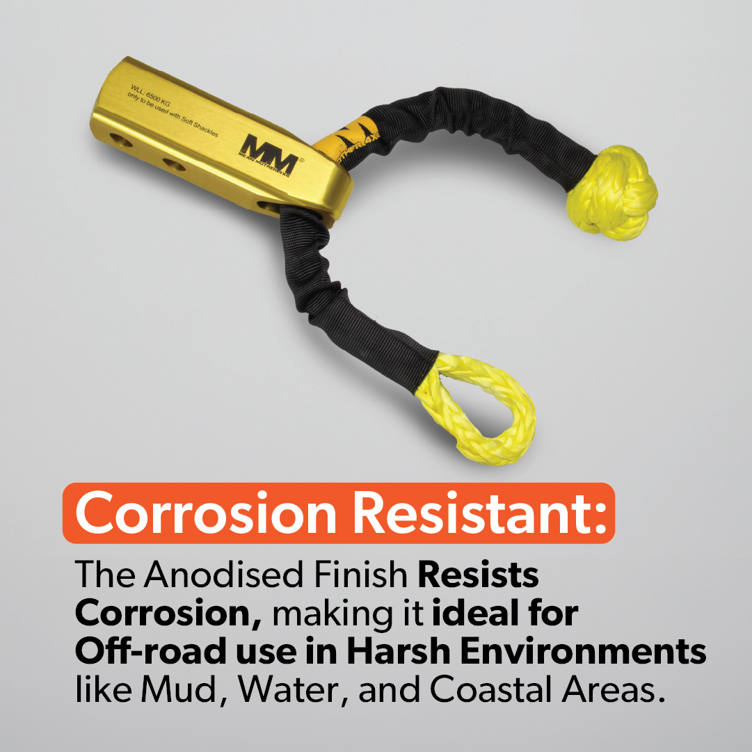 A Mean Mother 4x4 Recovery Hitch and yellow anodized metal shackle with black and yellow synthetic rope are displayed on a gray background, highlighting their corrosion resistance and suitability for harsh off-road use.