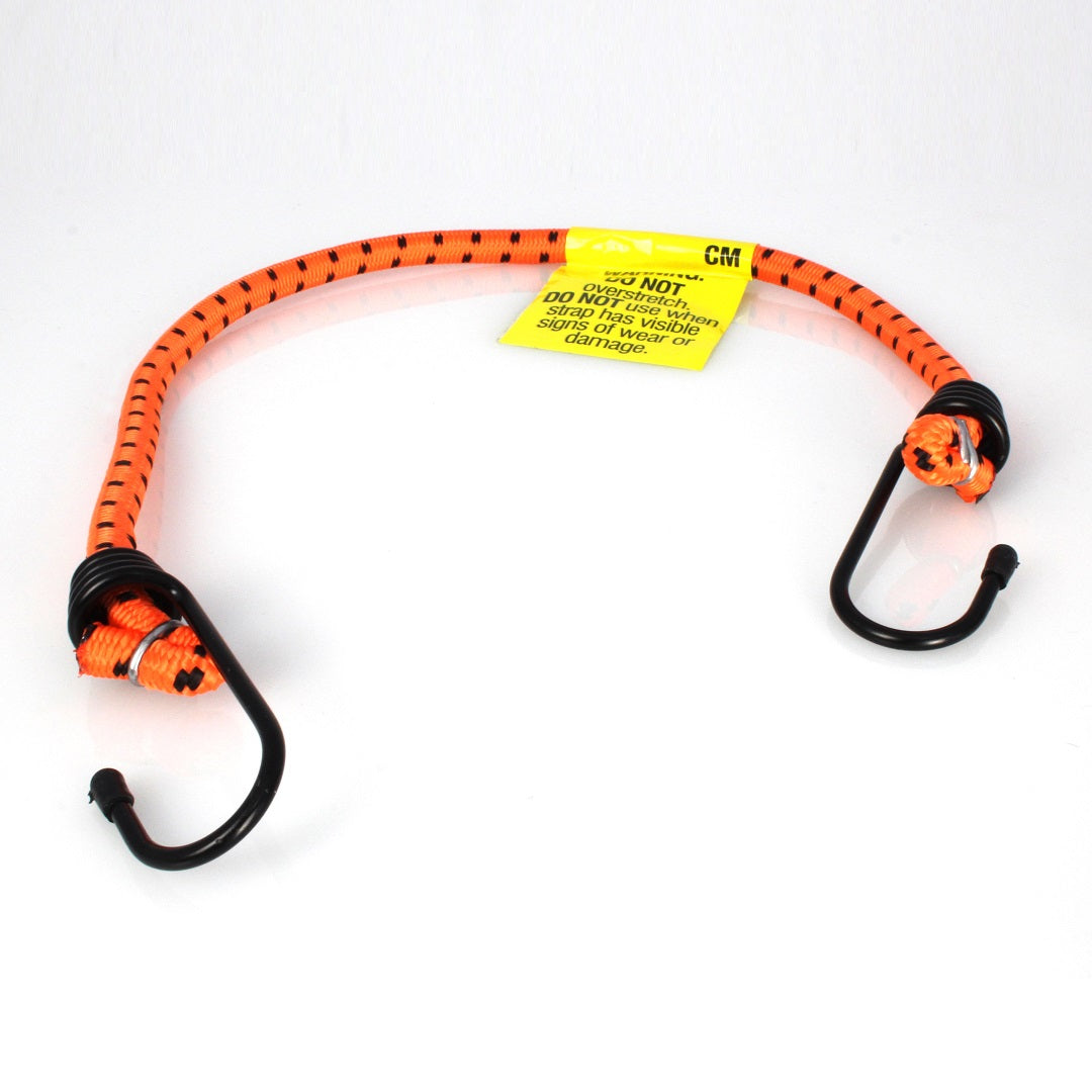 The Cargo Mate Occy Strap - 105cm by Cargo Mate is depicted on a white background. This orange bungee cord features black hooks on each end and includes a yellow warning label with safety instructions attached to the elastic cord.