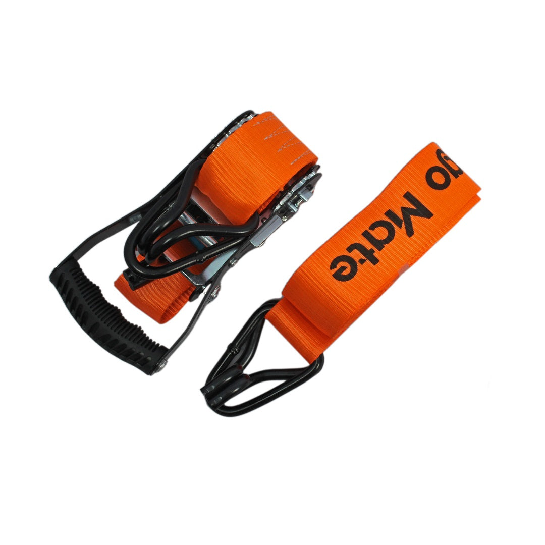 A Cargo Mate Heavy Duty Ratchet Tie Down, 38mm x 4.5m, in orange with black handles, features durable polypropylene webbing designed for heavy-duty use. The strap is compactly coiled and showcases black plastic and metal components. The text "Go Mate" is printed on the orange fabric, and it boasts a secure locking ratchet action mechanism.