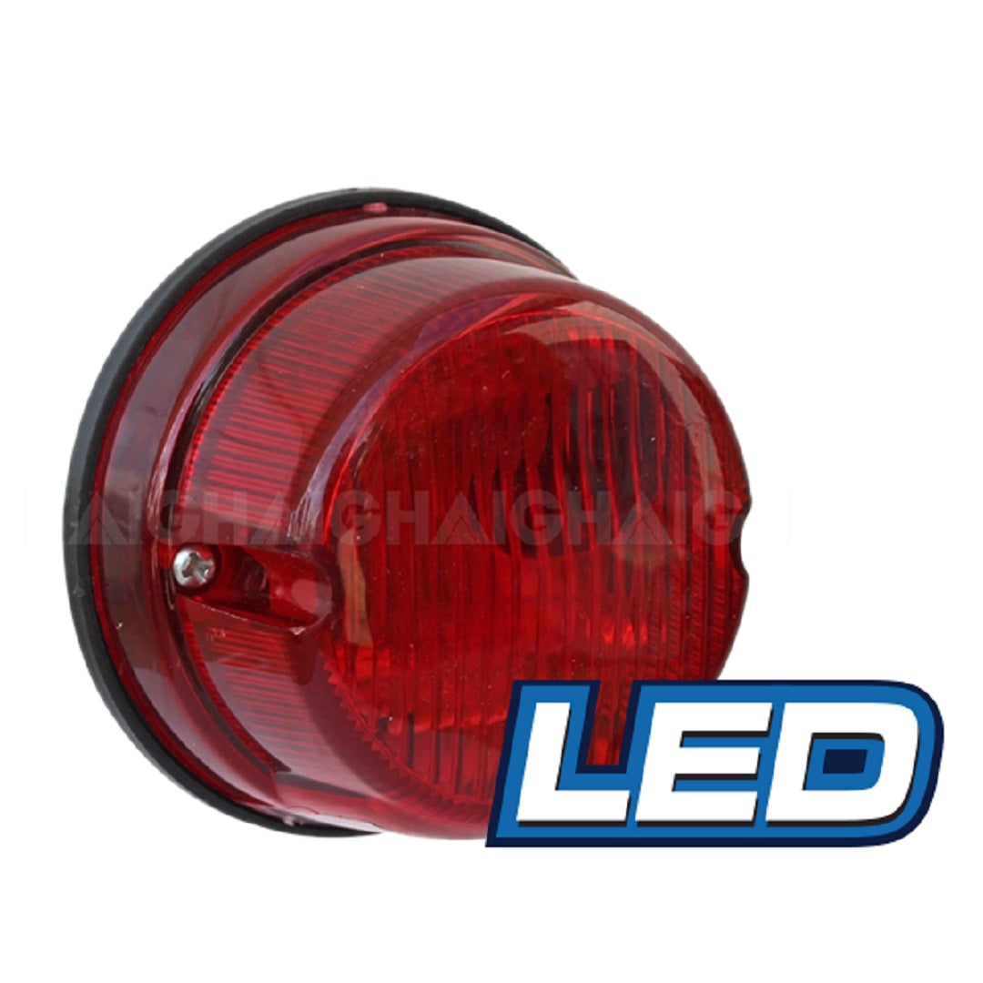 A round red **Eagle Eye LED Round Trailer Lamp - Combination** with a ridged surface is displayed against a white background. The word "LED" is prominently shown in blue and white text at the bottom right corner of the image, highlighting its 50,000 hours rated life for reliable performance.