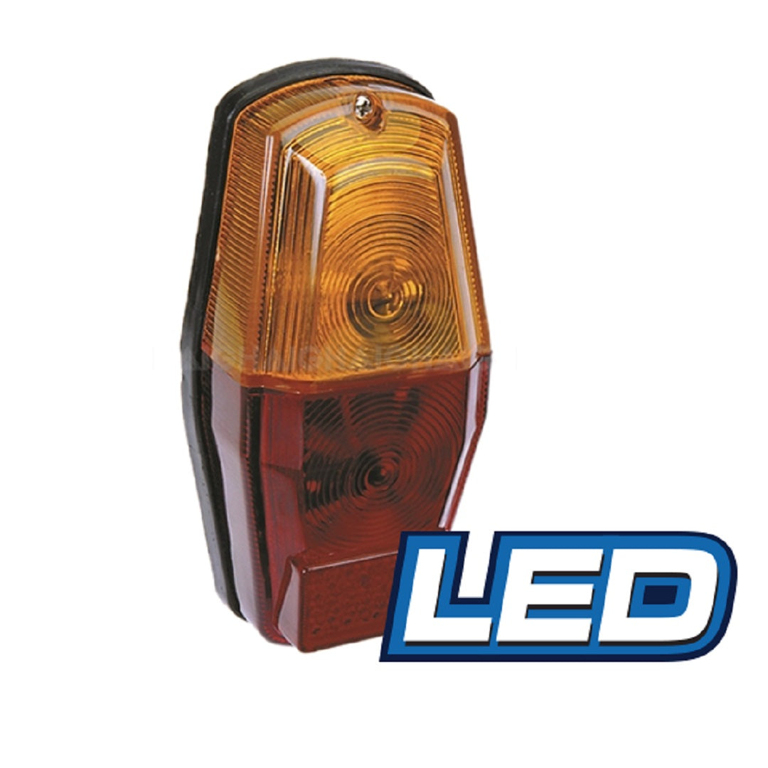 The Eagle Eye LED Trailer Lamp - Combination, featuring amber and red sections, is mounted on a black housing. The word "LED," highlighted in bold, blue text to the lower right of the light, signifies high-quality indicators for your vehicle.