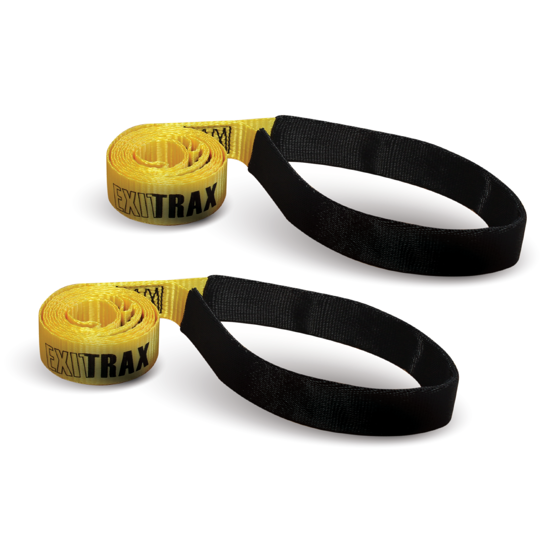 A pair of Exitrax Recovery Board Leashes coiled neatly. The yellow section labeled "EXITRAX" transitions into a black loop at the end, suitable for hooking or attaching. Made from heavy-duty polyester, both identical straps are laid side by side, perfect as recovery leashes.