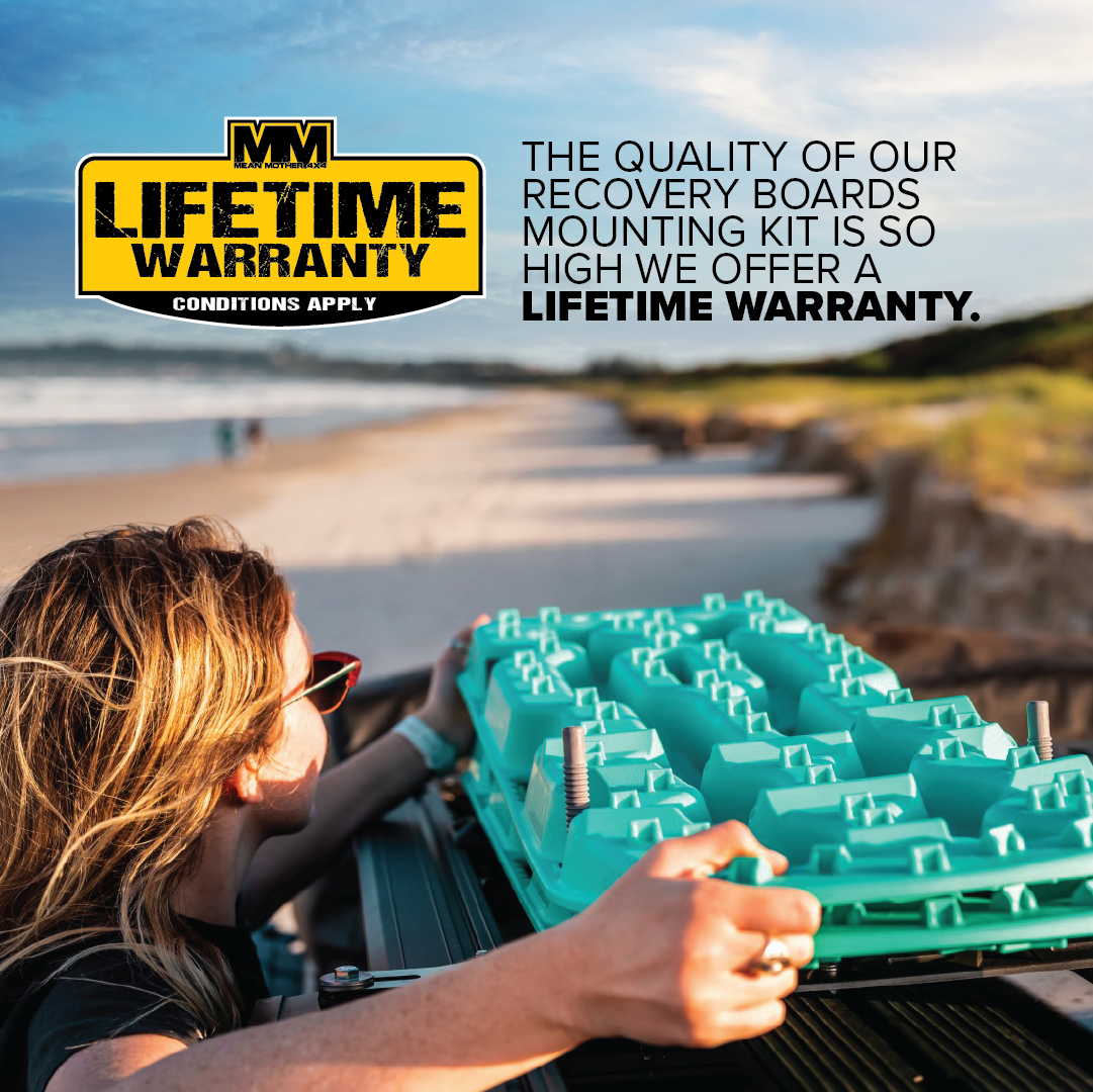 A person with blonde hair securely places a turquoise recovery board onto a mount on the roof of a vehicle. The text on the image reads, "The quality of our Exitrax Recovery Board Mounting Kit is so high we offer a lifetime warranty. Quick Release and Universal Mounting Brackets included. Lifetime warranty conditions apply.