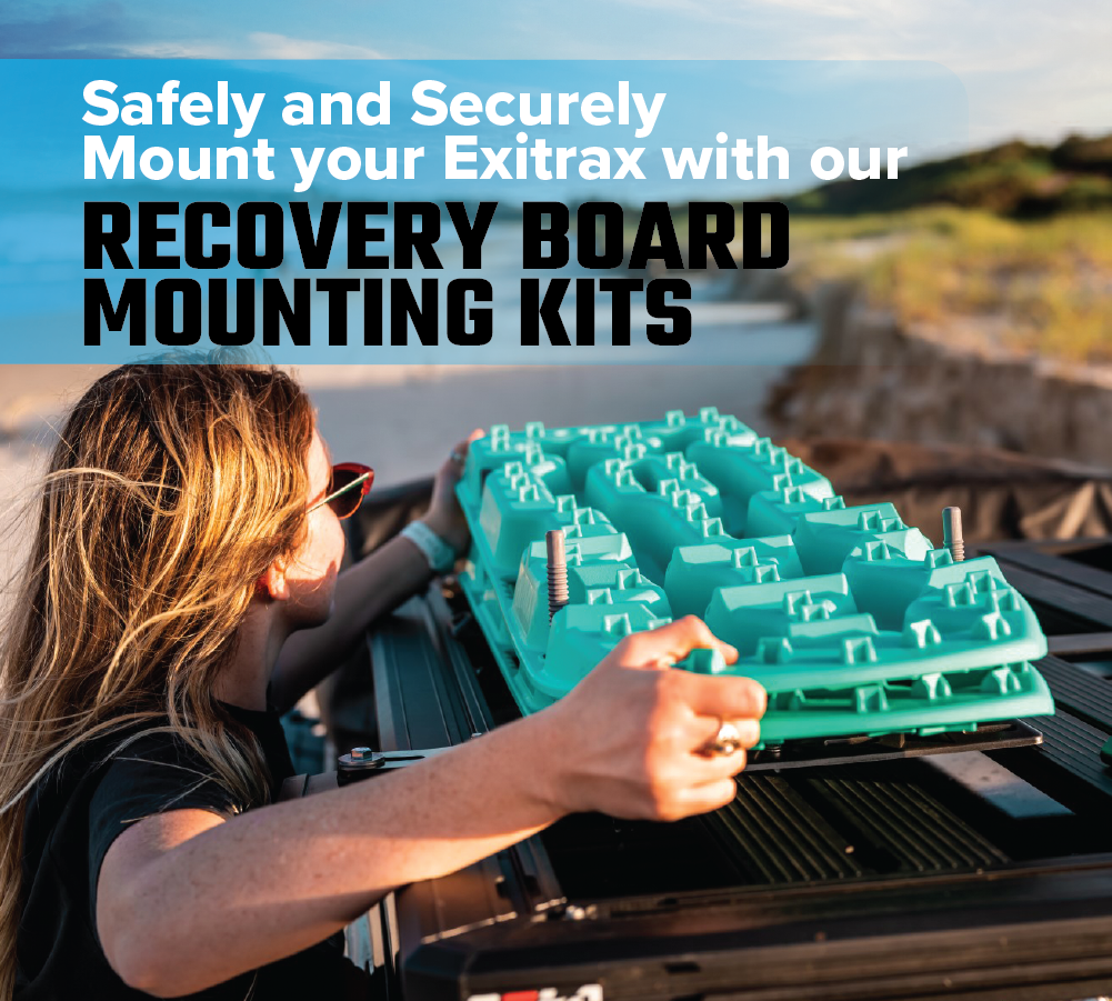 An individual secures an Exitrax Recovery Board Ultimate 1150 in Aqua Marine onto a vehicle using the included Recovery Board Mounts Bundle. Text overlay reads: "Safely and Securely Mount your Exitrax with our Recovery Board Mounting Kits." The backdrop displays a sandy beach under a clear sky.