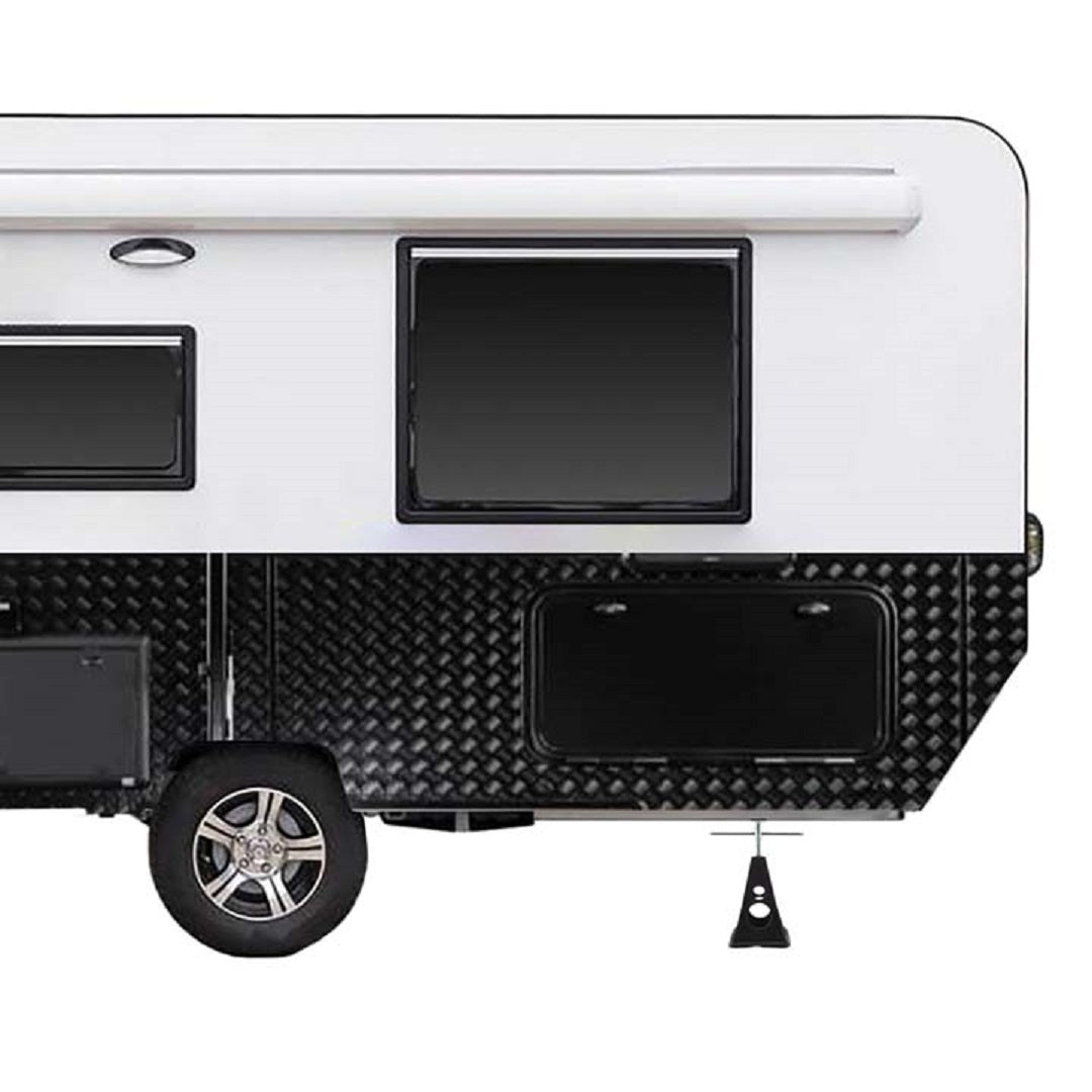 Side view of the Explore Caravan Stabiliser Stand - 2pk featuring a modern travel trailer design with a white upper half and a black lower half adorned with a diamond plate pattern. The trailer includes a window with an awning, storage compartment door, single wheel equipped with chunky tire, and Explore's adjustable camper stabilizer stands for added stability. Its construction is both durable and reliable, perfect for any adventure.