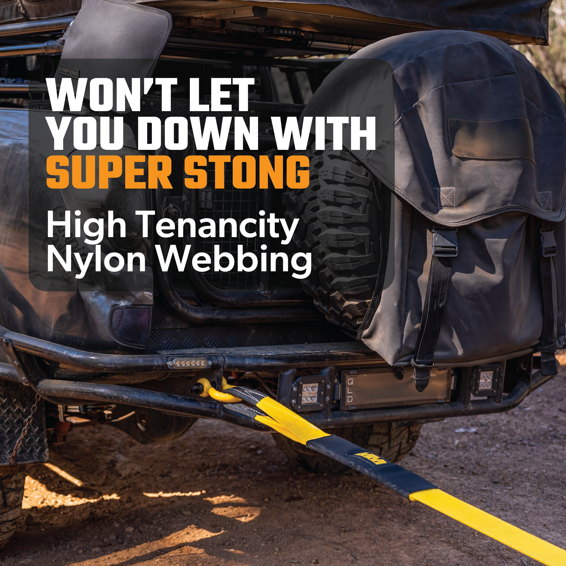 A tough vehicle features a Mean Mother Snatch Strap 8,000kg made from super strong high-tenacity nylon webbing, living up to the promise of "Won't let you down with super strong high-tenacity nylon webbing." Completing the setup is a large gear bag securely attached with reinforced eyelets.