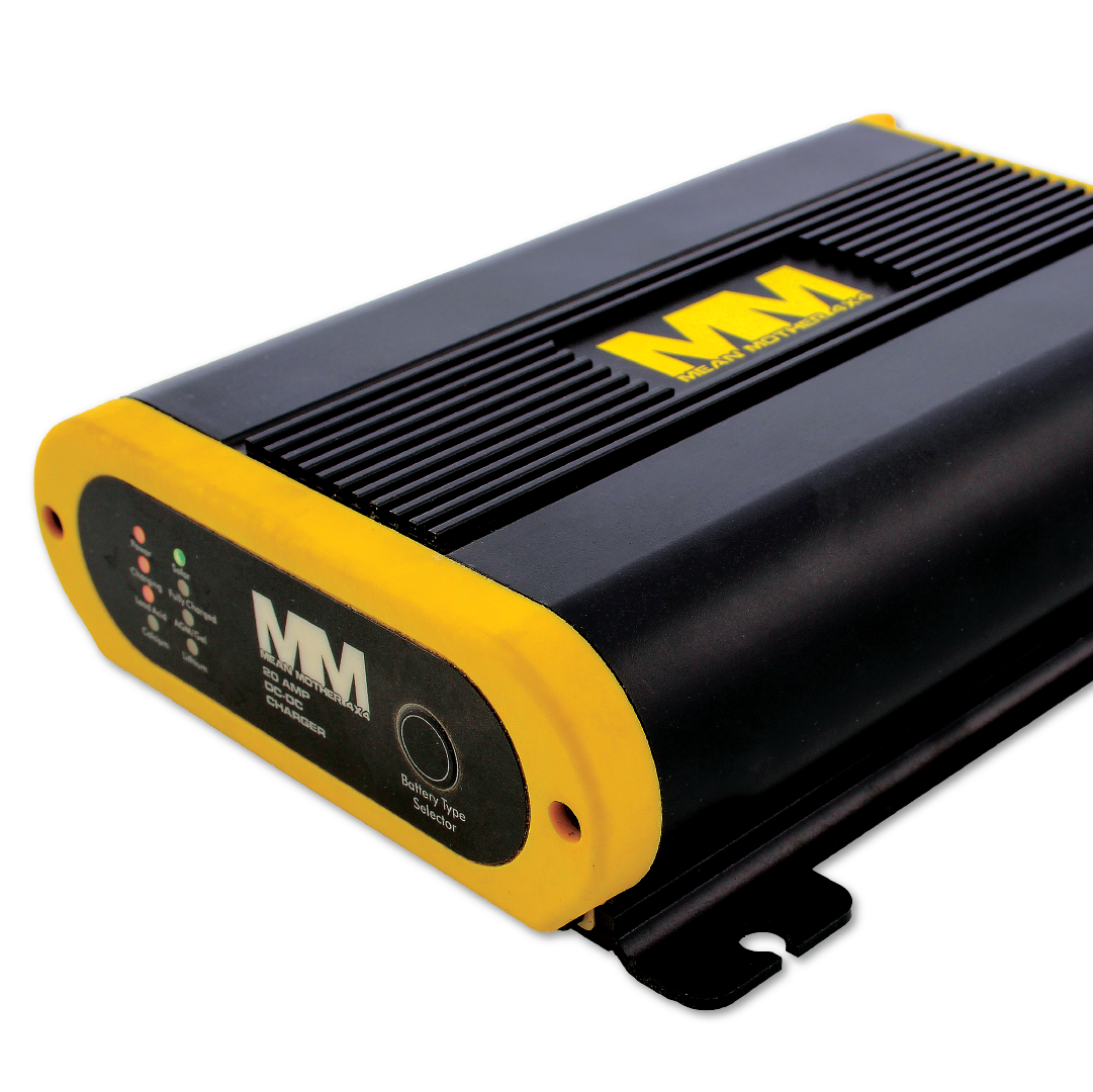 Image of a Mean Mother DCDC Charger 20 Amp with a black and yellow casing featuring the "MM" logo. The device has a power button, indicator lights, and ribbed sides for ventilation. Designed for installation in vehicles, it's compatible with auxiliary battery setups and integrates seamlessly with 4x4 gear by Mean Mother 4x4.