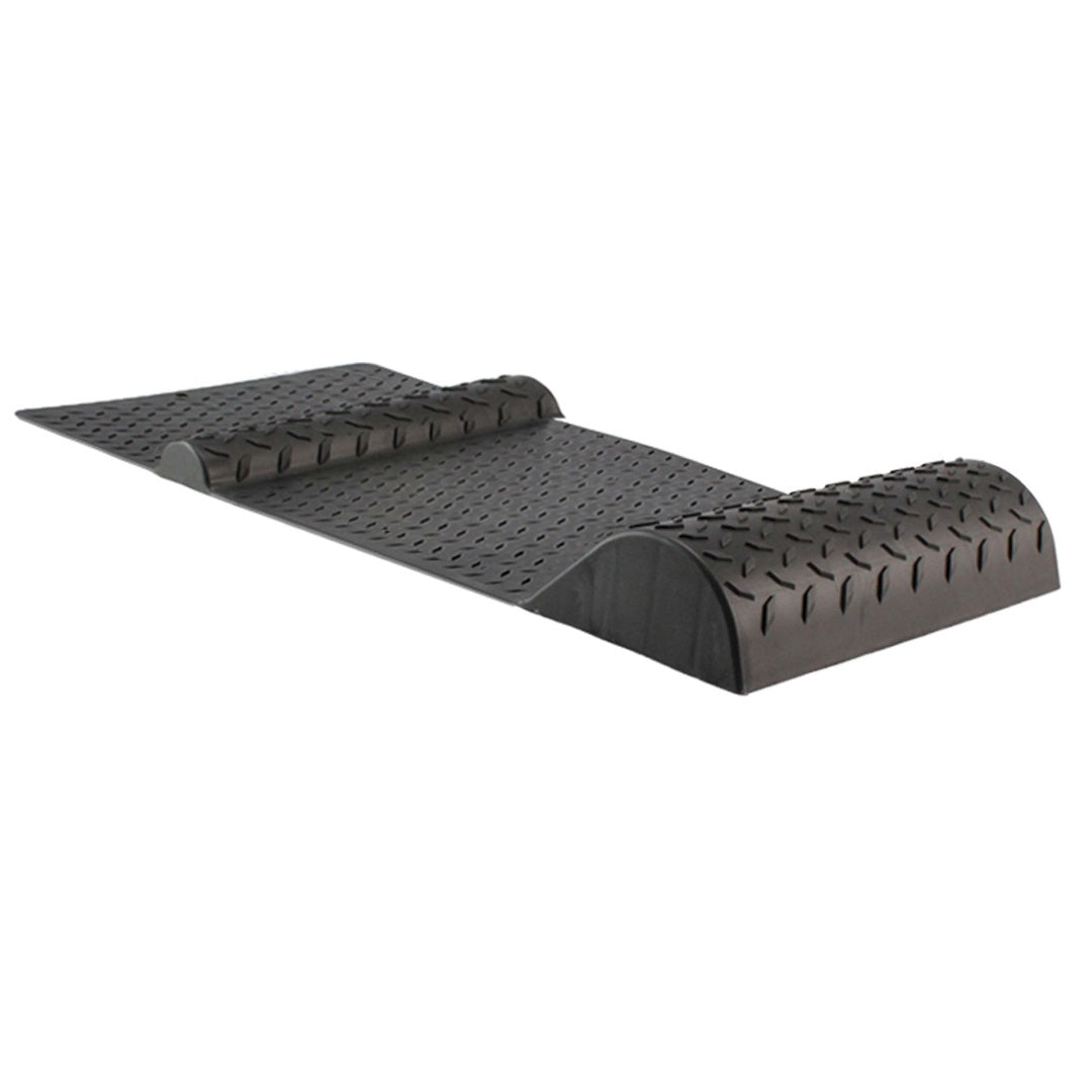 The Drive Parking Mat Wheel Stop by Drive is a black, ramp-style automotive creeper with a textured surface and raised, curved sections at both ends. It's designed for sliding under vehicles for maintenance work. The flat middle section offers comfortable positioning, making it an essential car storage solution in any garage.