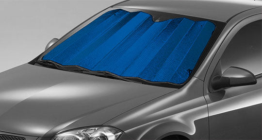 A Sunland-Protection Car Sun Shade (150cm x 70cm, Blue) is placed on a gray car against a plain background, providing effective UV protection with its accordion-folded design and reflective material.